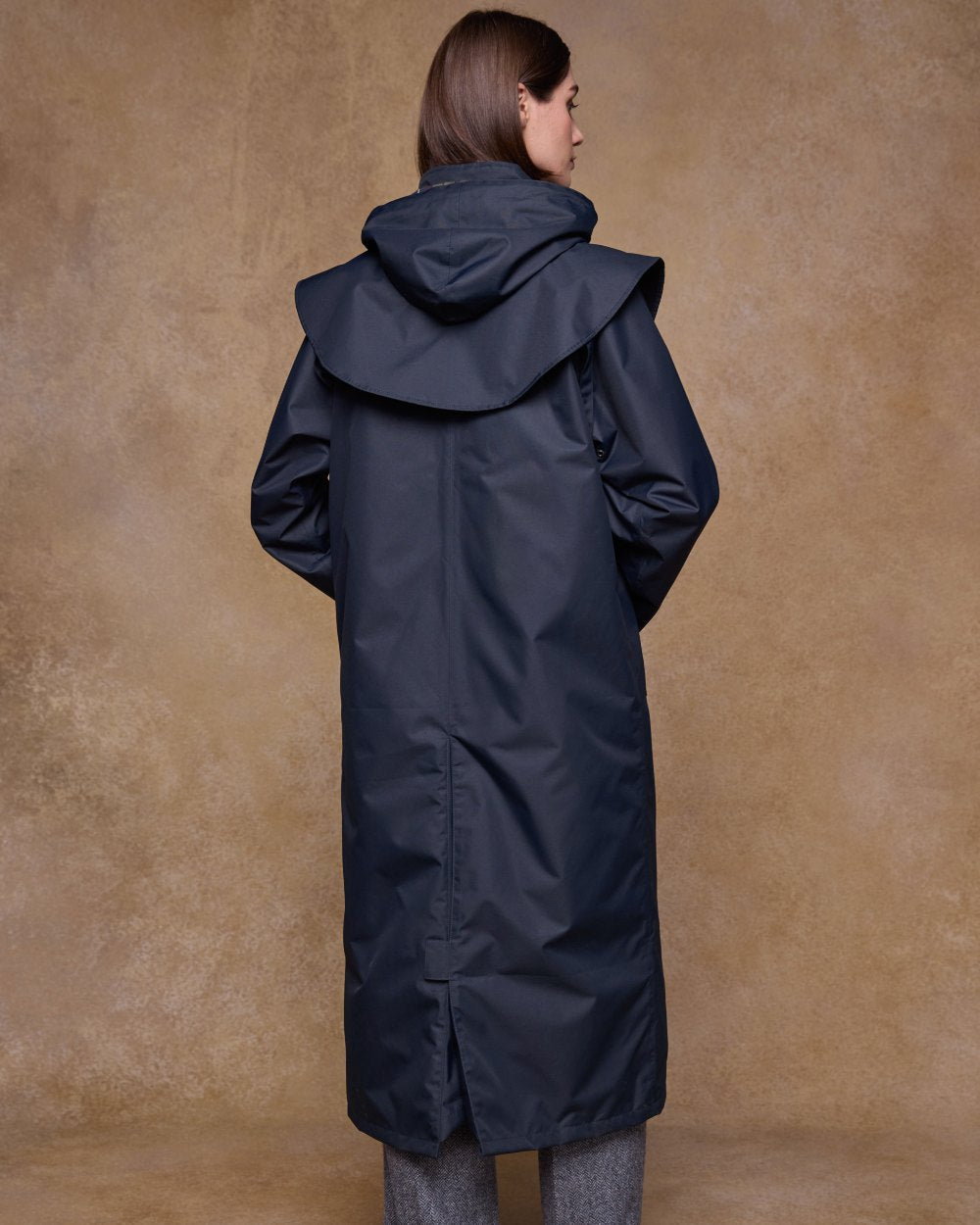 Navy Coloured Jack Murphy Womens Connemara Waterproof Coat on indoor background 