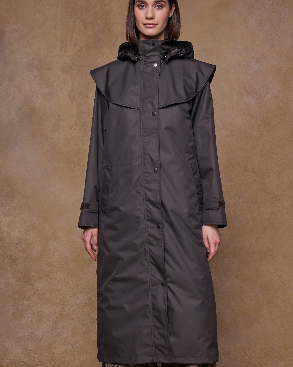 Olive Coloured Jack Murphy Womens Connemara Waterproof Coat on indoor background 