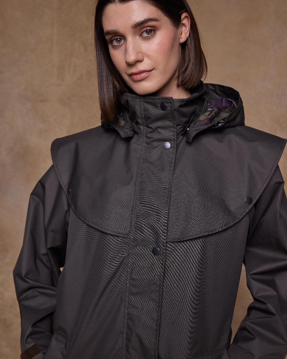 Olive Coloured Jack Murphy Womens Connemara Waterproof Coat on indoor background 
