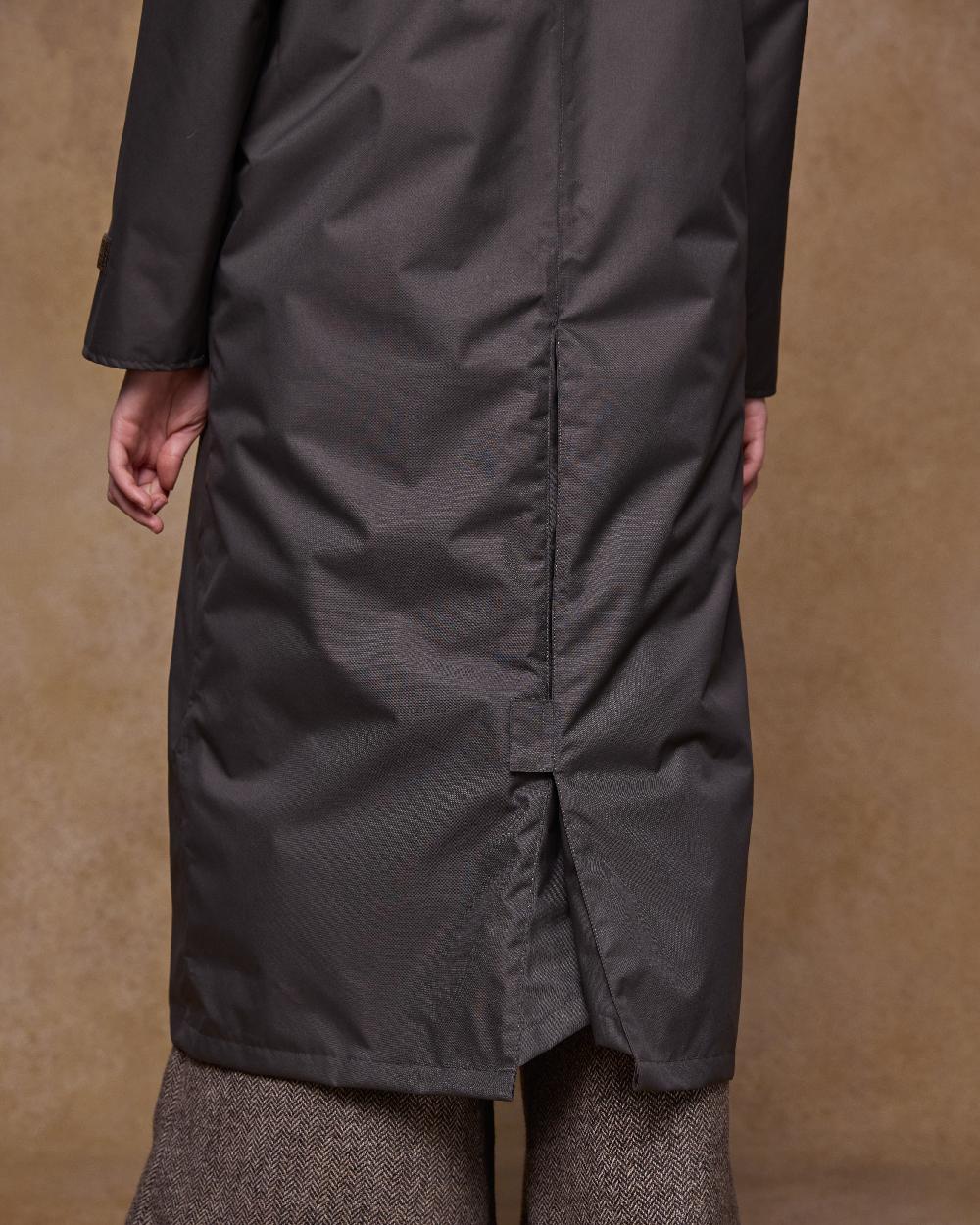 Olive Coloured Jack Murphy Womens Connemara Waterproof Coat on indoor background 