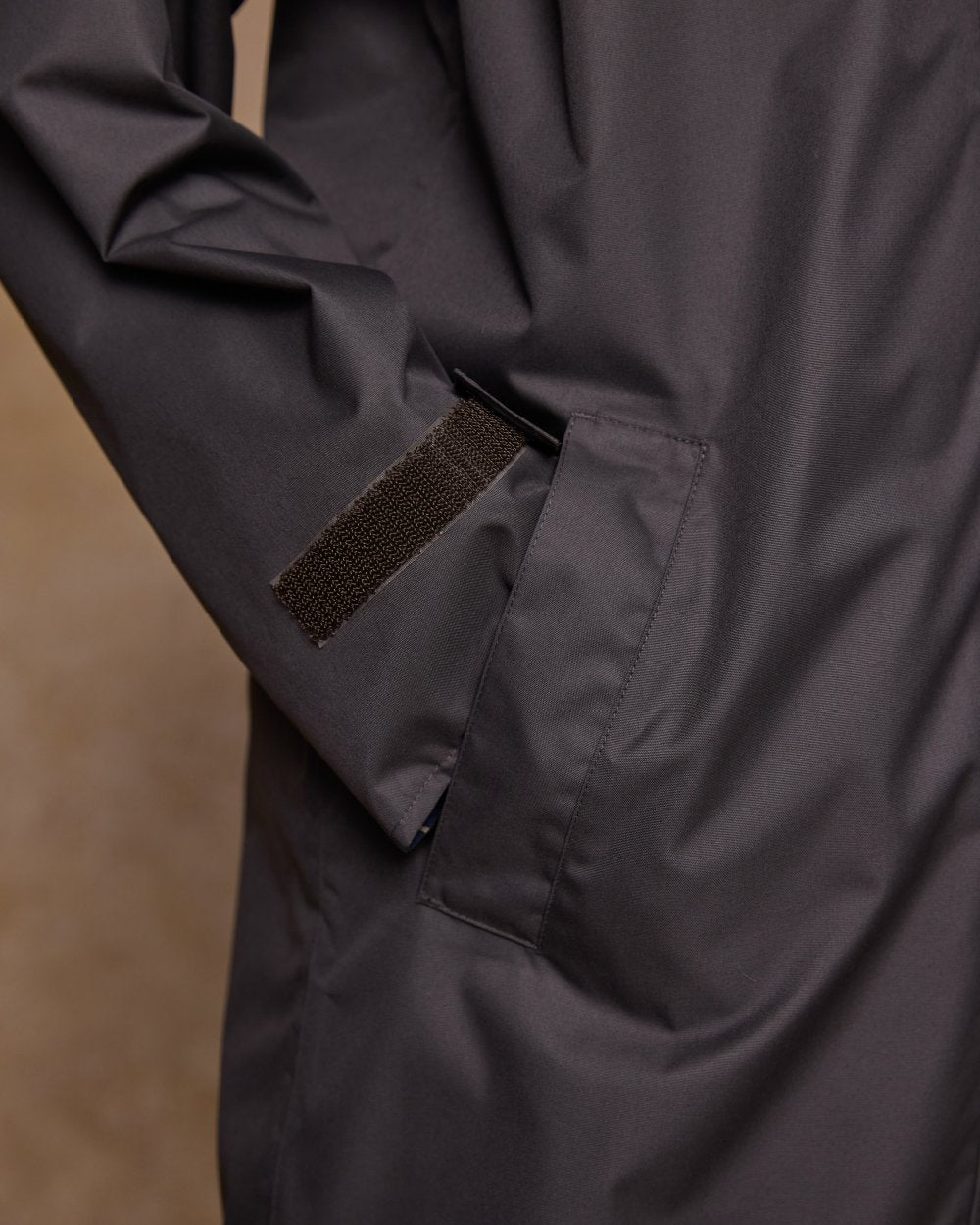 Olive Coloured Jack Murphy Womens Connemara Waterproof Coat on indoor background 