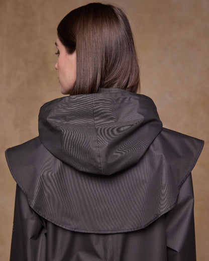 Olive Coloured Jack Murphy Womens Connemara Waterproof Coat on indoor background 