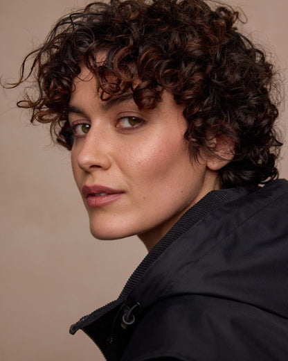 Black Coloured Jack Murphy Womens Dingle Waterproof Jacket on indoor background 