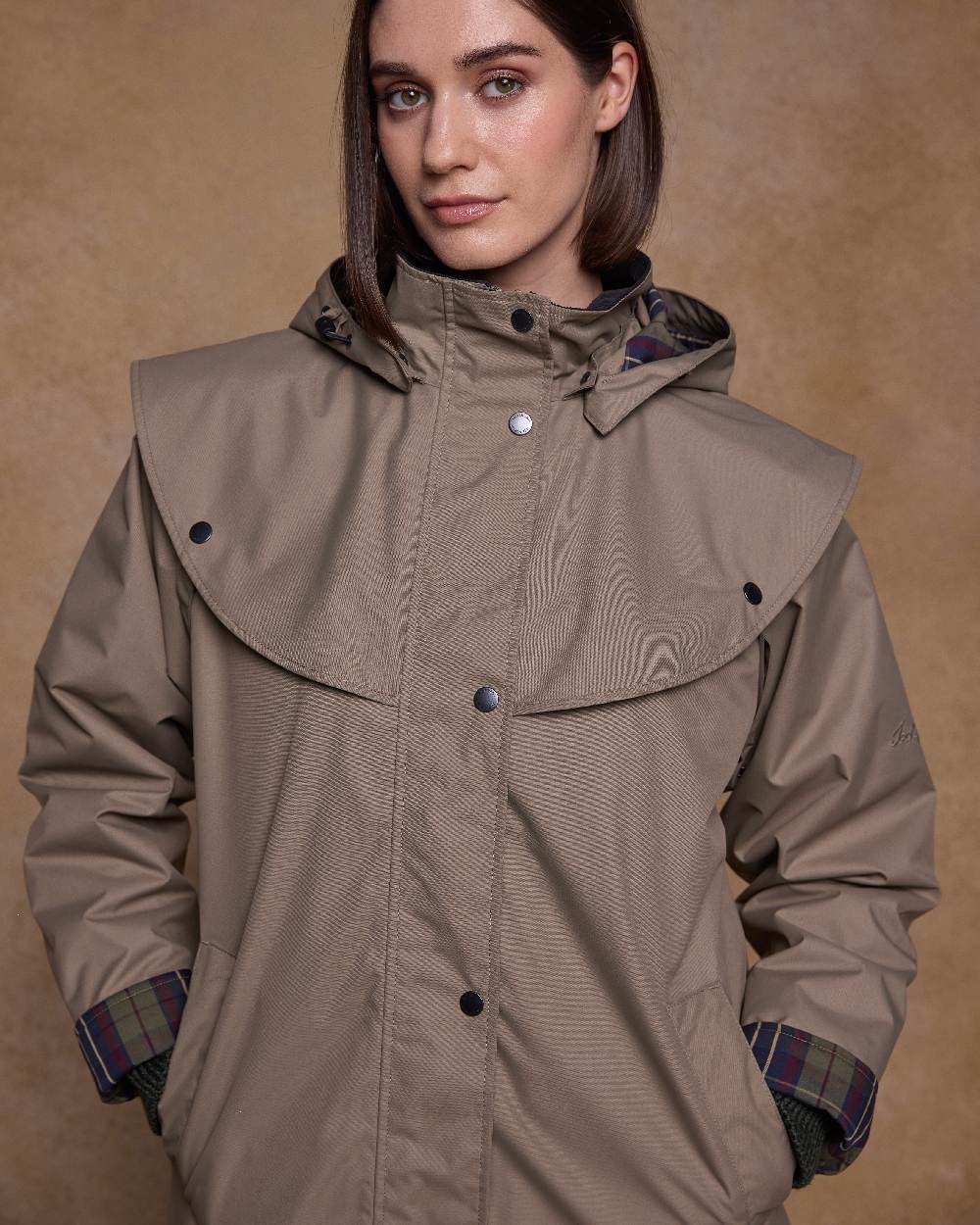 Chinchilla Coloured Jack Murphy Womens Dingle Waterproof Jacket on indoor background 