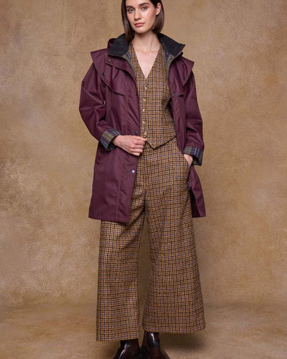 Deep Claret Coloured Jack Murphy Womens Dingle Waterproof Jacket on indoor background 