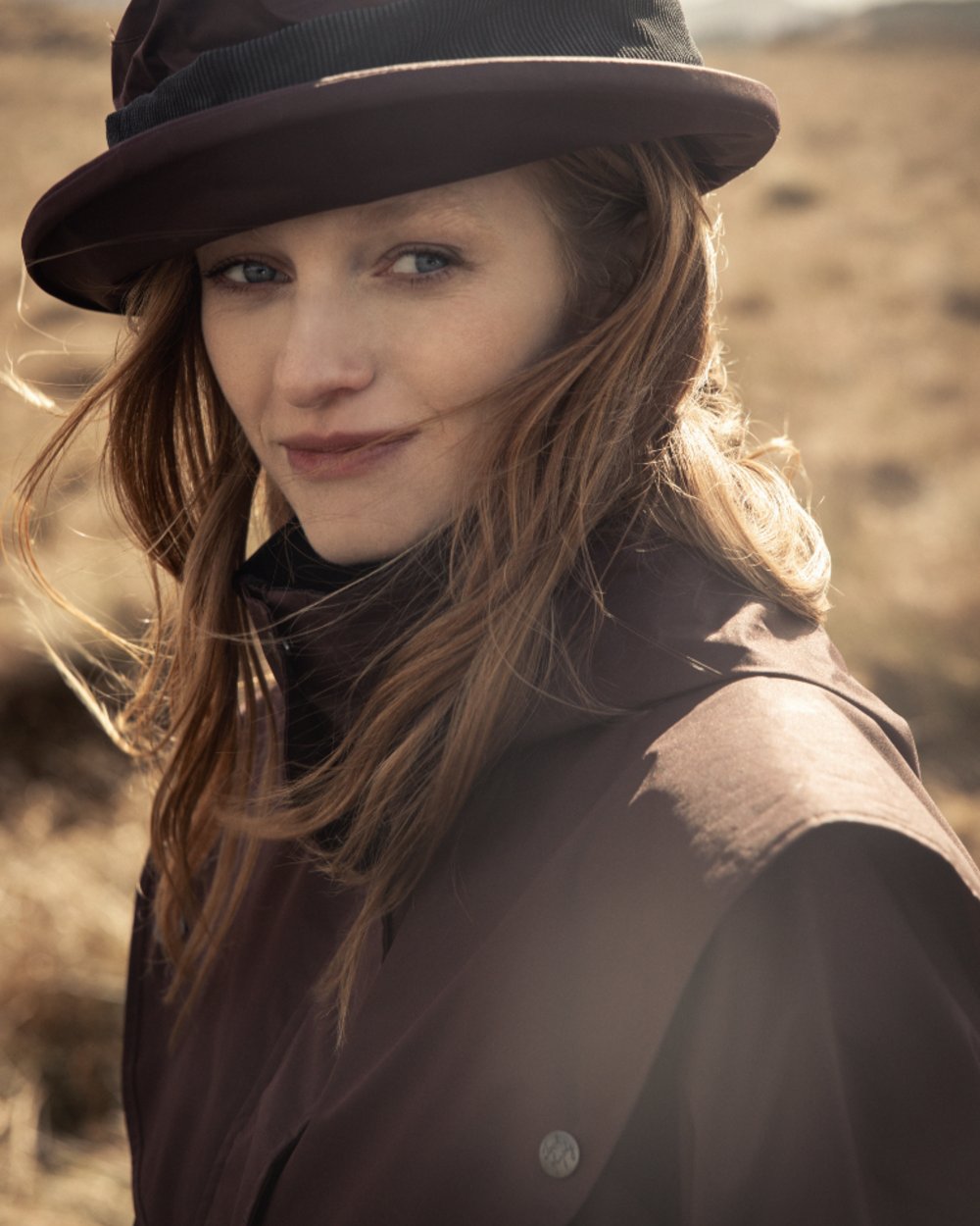 Deep Claret Coloured Jack Murphy Womens Dingle Waterproof Jacket on mountain background 