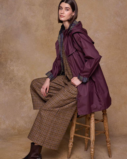 Deep Claret Coloured Jack Murphy Womens Dingle Waterproof Jacket on indoor background 
