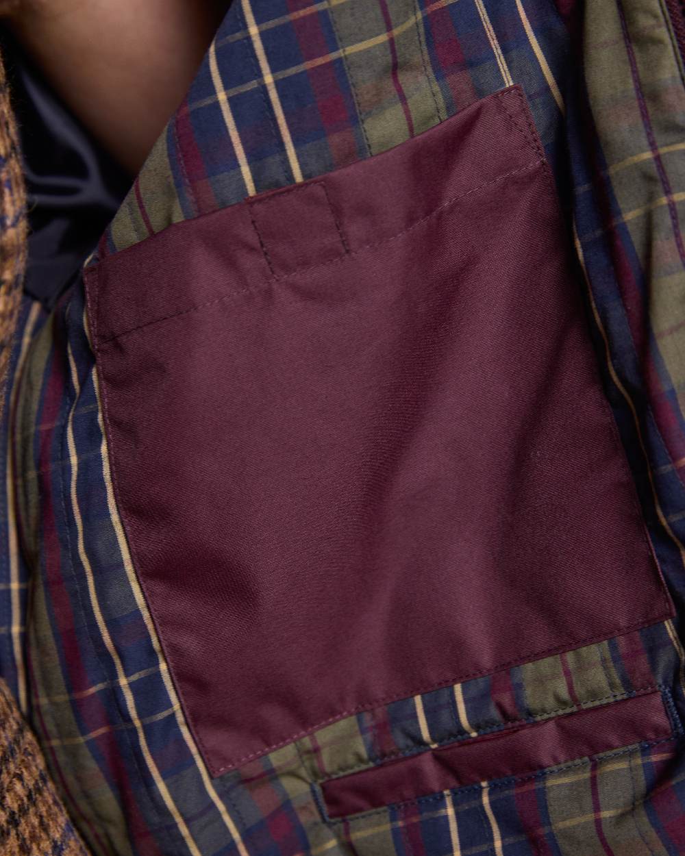 Deep Claret Coloured Jack Murphy Womens Dingle Waterproof Jacket on indoor background 