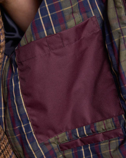 Deep Claret Coloured Jack Murphy Womens Dingle Waterproof Jacket on indoor background 