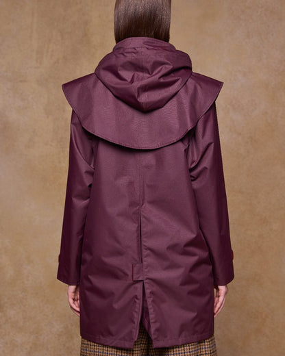 Deep Claret Coloured Jack Murphy Womens Dingle Waterproof Jacket on indoor background 