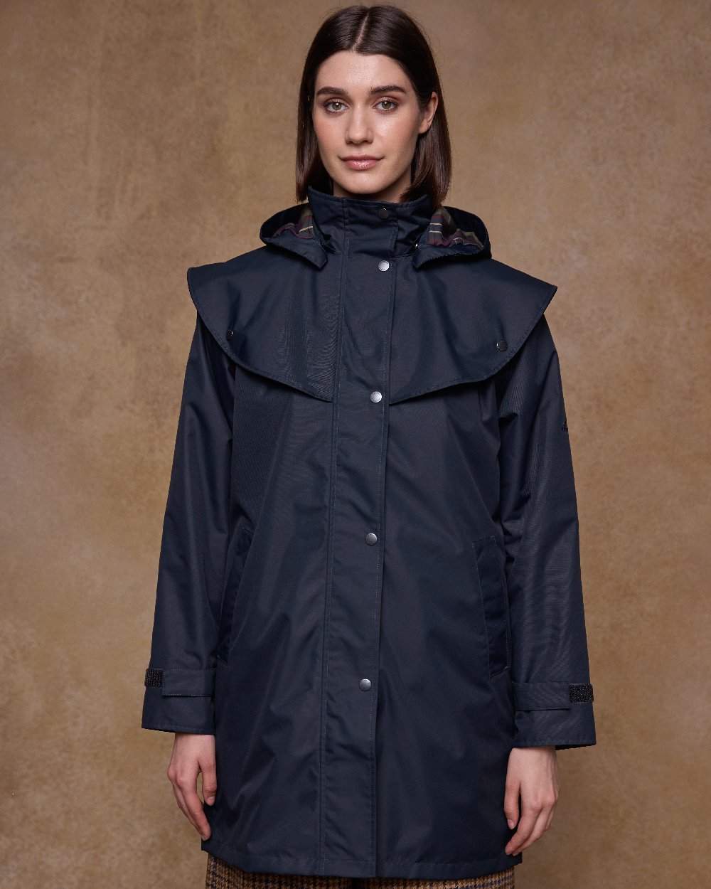 Navy Coloured Jack Murphy Womens Dingle Waterproof Jacket on indoor background 