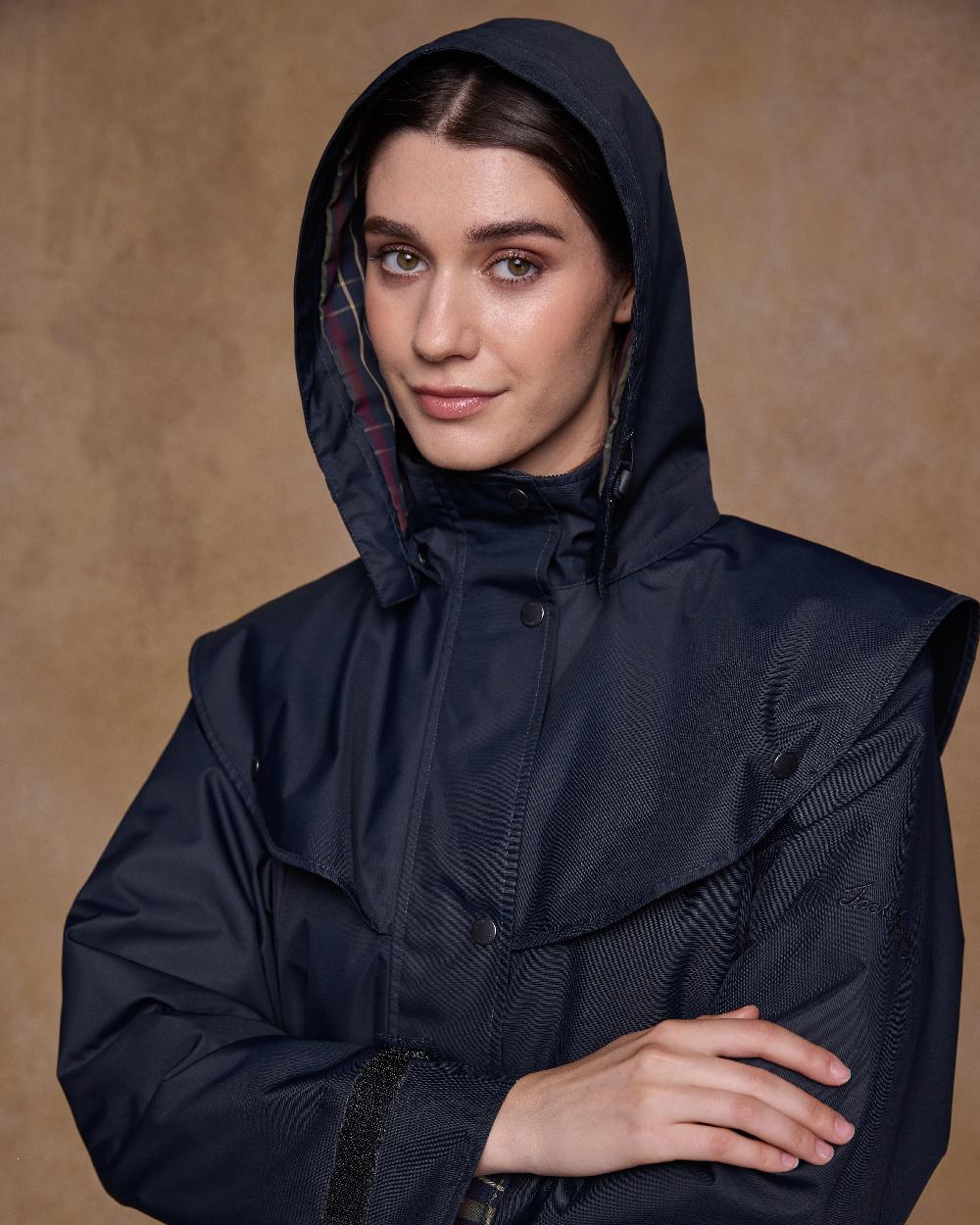Navy Coloured Jack Murphy Womens Dingle Waterproof Jacket on indoor background 