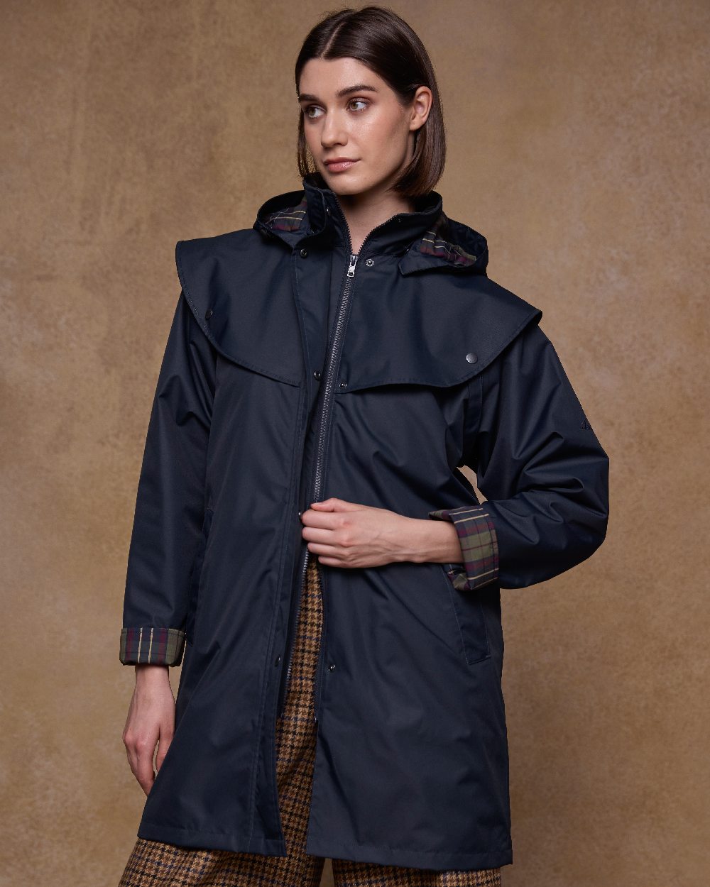Navy Coloured Jack Murphy Womens Dingle Waterproof Jacket on indoor background 