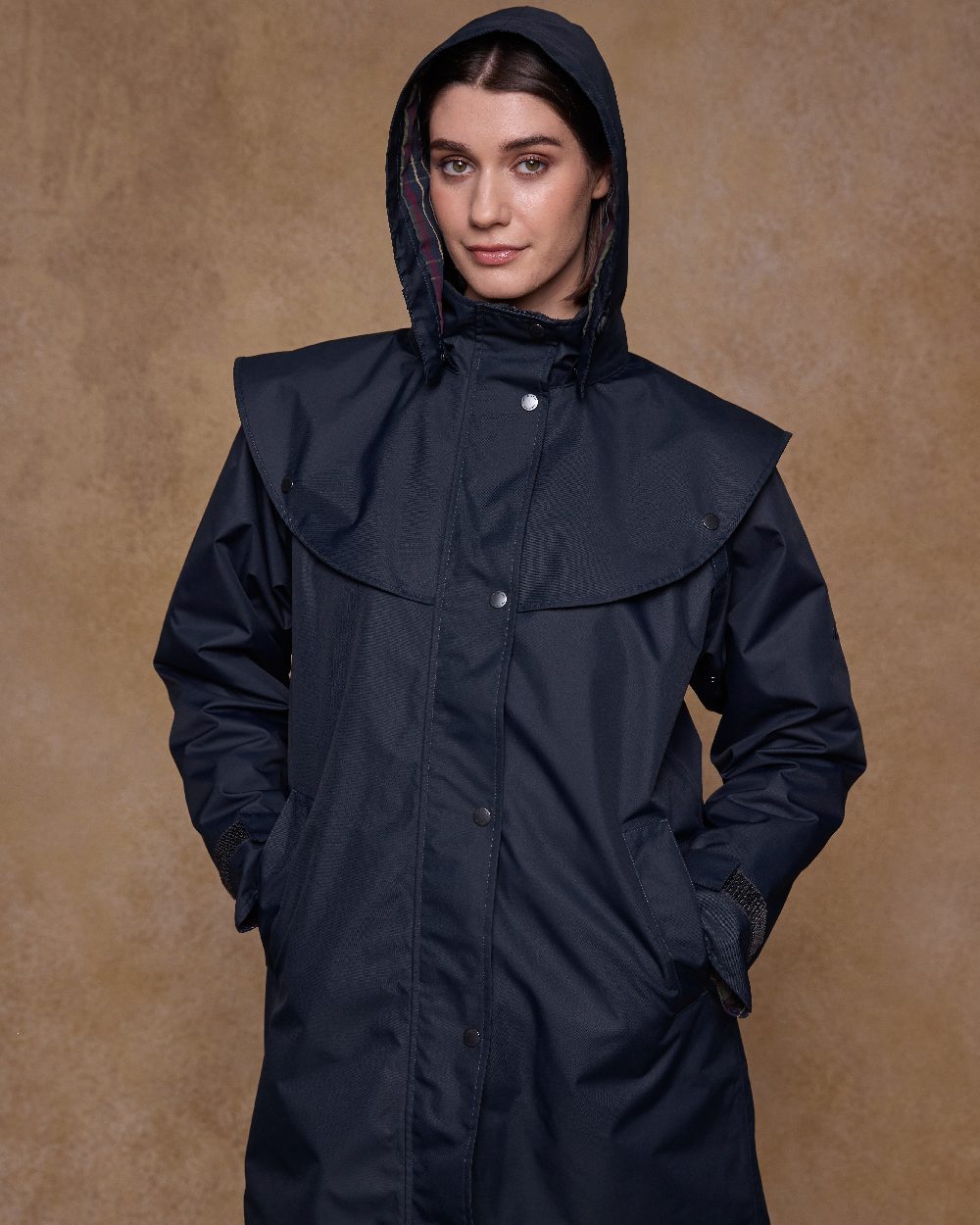 Navy Coloured Jack Murphy Womens Dingle Waterproof Jacket on indoor background 
