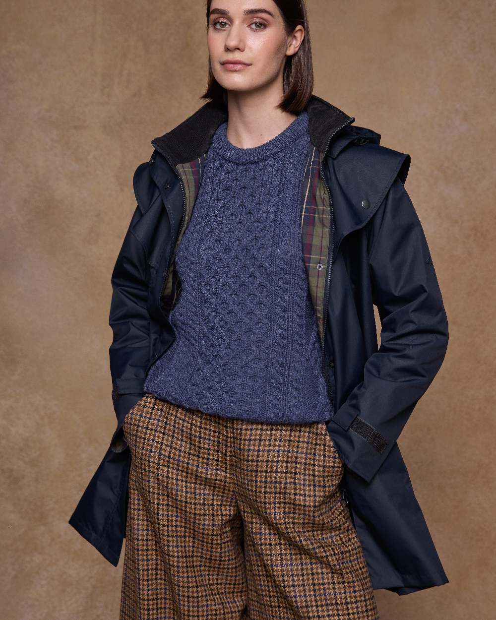 Navy Coloured Jack Murphy Womens Dingle Waterproof Jacket on indoor background 