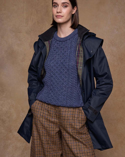 Navy Coloured Jack Murphy Womens Dingle Waterproof Jacket on indoor background 