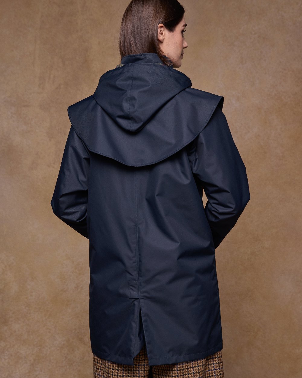 Navy Coloured Jack Murphy Womens Dingle Waterproof Jacket on indoor background 