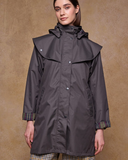 Olive Coloured Jack Murphy Womens Dingle Waterproof Jacket on indoor background 