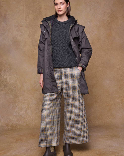 Olive Coloured Jack Murphy Womens Dingle Waterproof Jacket on indoor background 