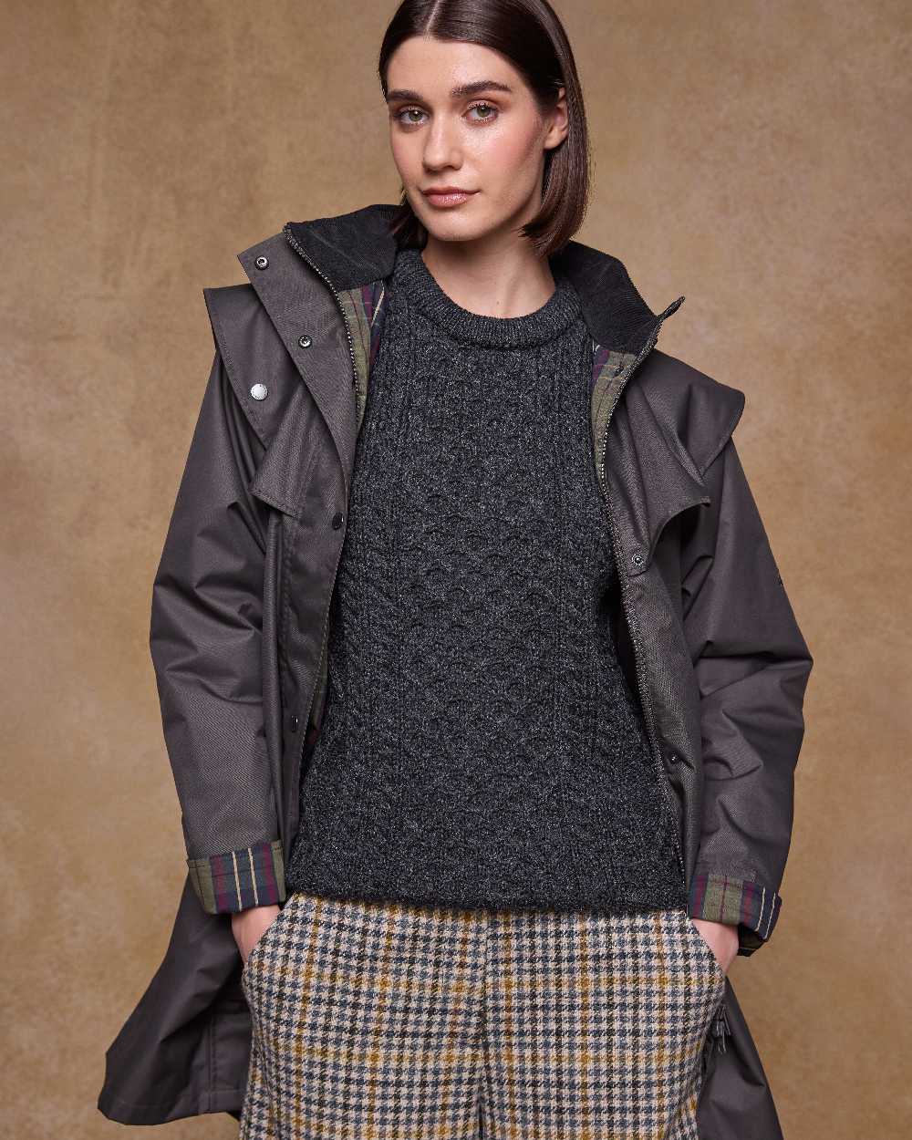 Olive Coloured Jack Murphy Womens Dingle Waterproof Jacket on indoor background 