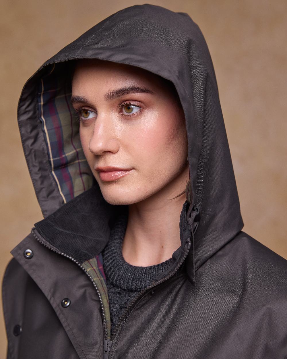 Olive Coloured Jack Murphy Womens Dingle Waterproof Jacket on indoor background 