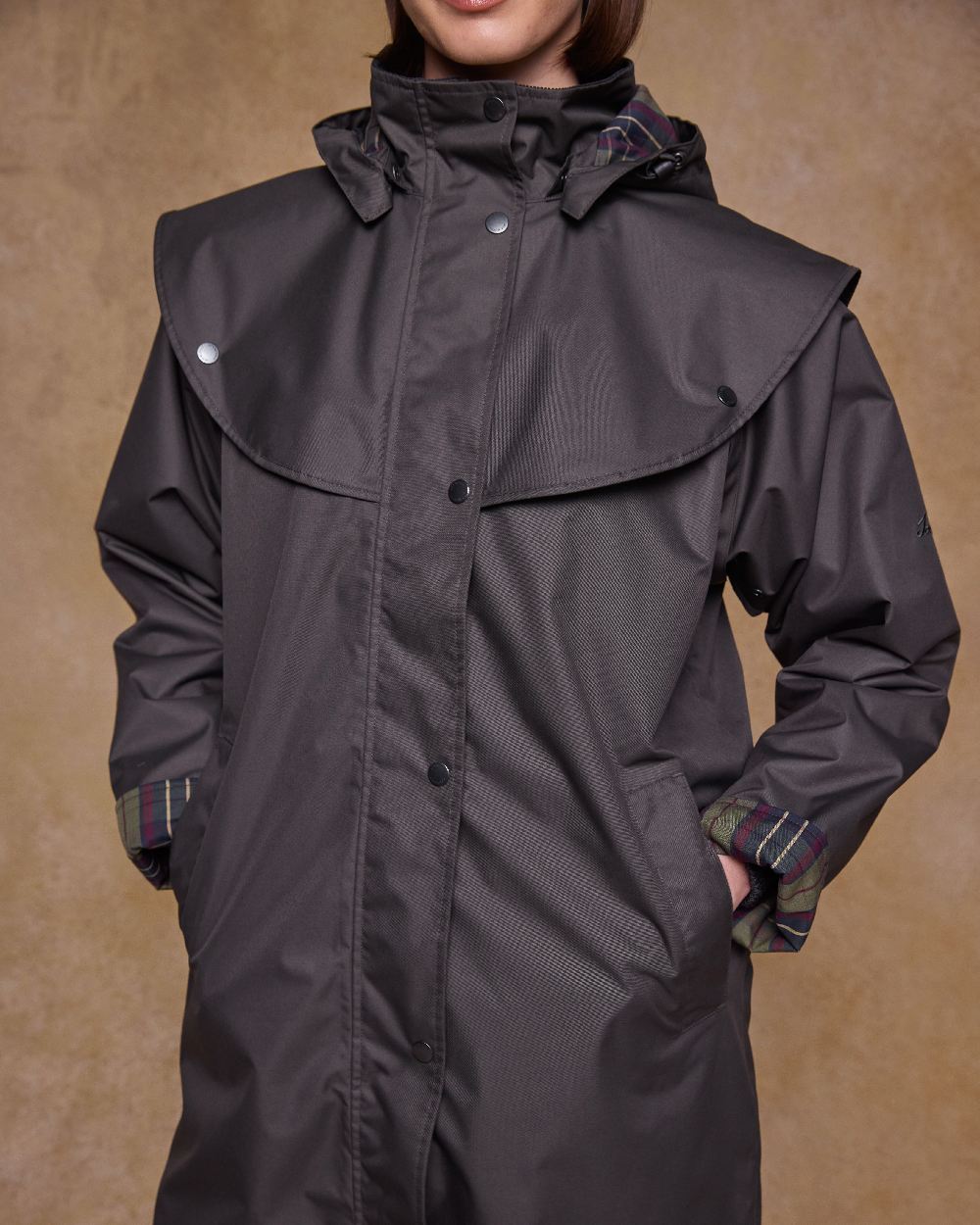 Olive Coloured Jack Murphy Womens Dingle Waterproof Jacket on indoor background 
