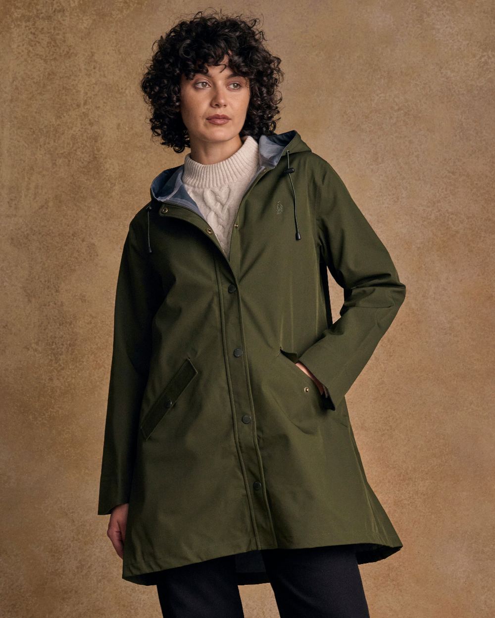 Olive Coloured Jack Murphy Womens Fiadh Waterproof Jacket on indoor background 