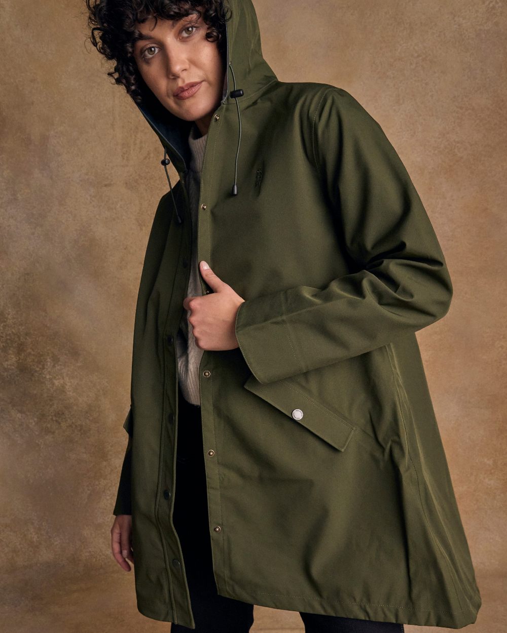 Olive Coloured Jack Murphy Womens Fiadh Waterproof Jacket on indoor background 