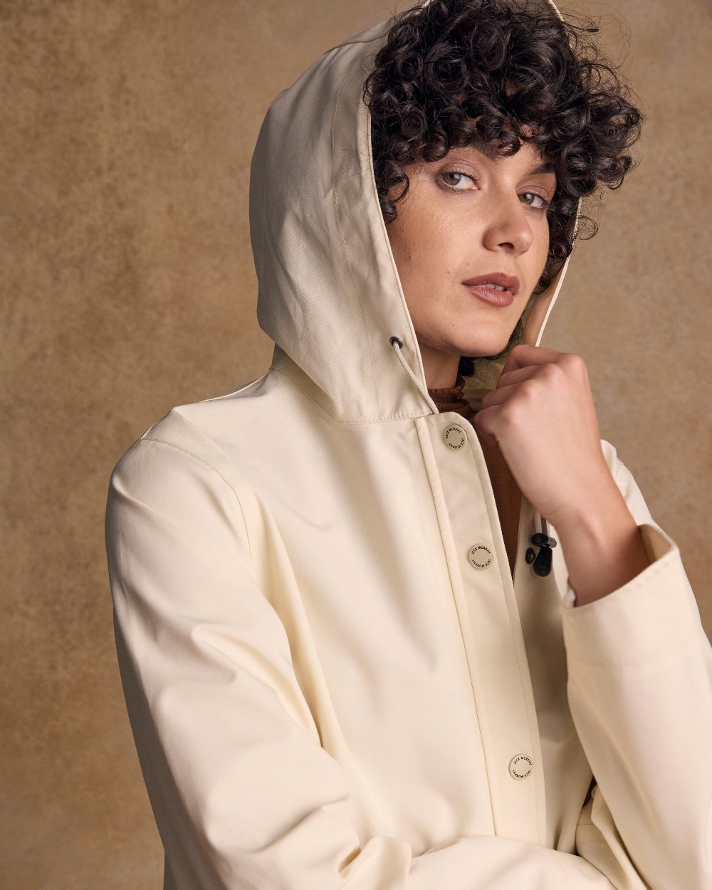 Pearl Coloured Jack Murphy Womens Fiadh Waterproof Jacket on indoor background 