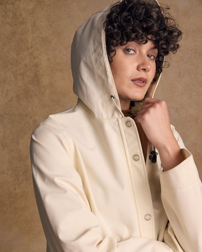 Pearl Coloured Jack Murphy Womens Fiadh Waterproof Jacket on indoor background 