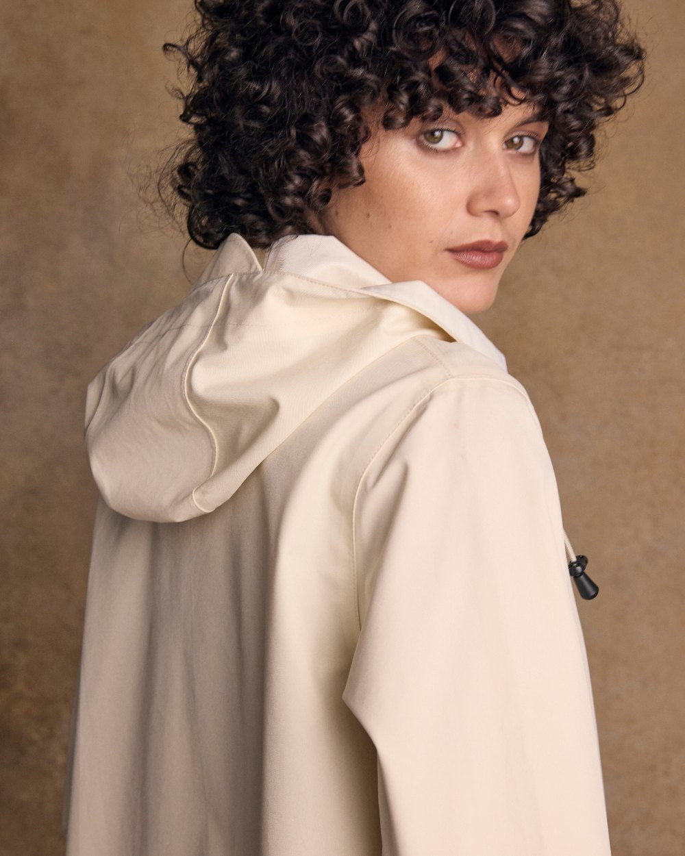 Pearl Coloured Jack Murphy Womens Fiadh Waterproof Jacket on indoor background 