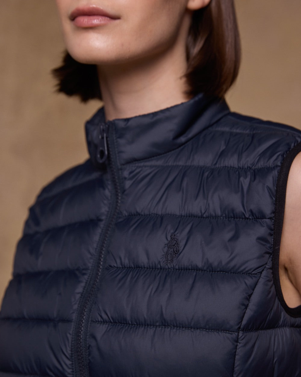 Navy Coloured Jack Murphy Womens Leah Puffa Gilet on indoor background 