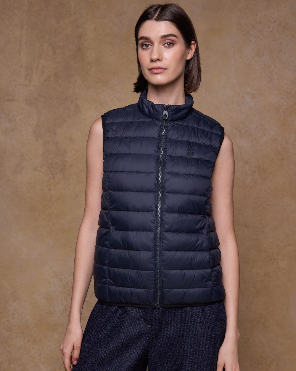Navy Coloured Jack Murphy Womens Leah Puffa Gilet on indoor background 