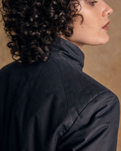 Navy Coloured Jack Murphy Womens Orla Wax Jacket on indoor background 