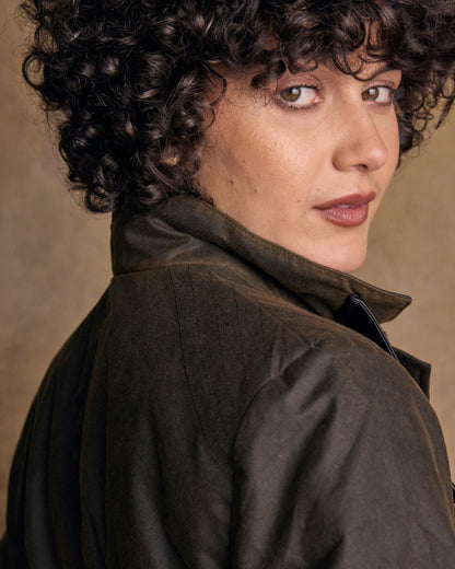 Olive Coloured Jack Murphy Womens Orla Wax Jacket on indoor background 