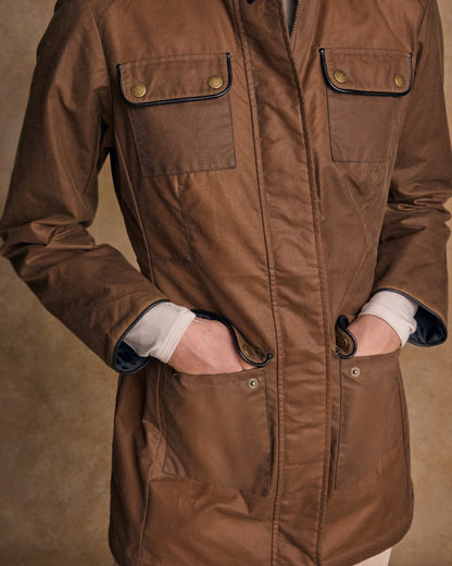 Tan Coloured Jack Murphy Womens Orla Wax Jacket on indoor background 