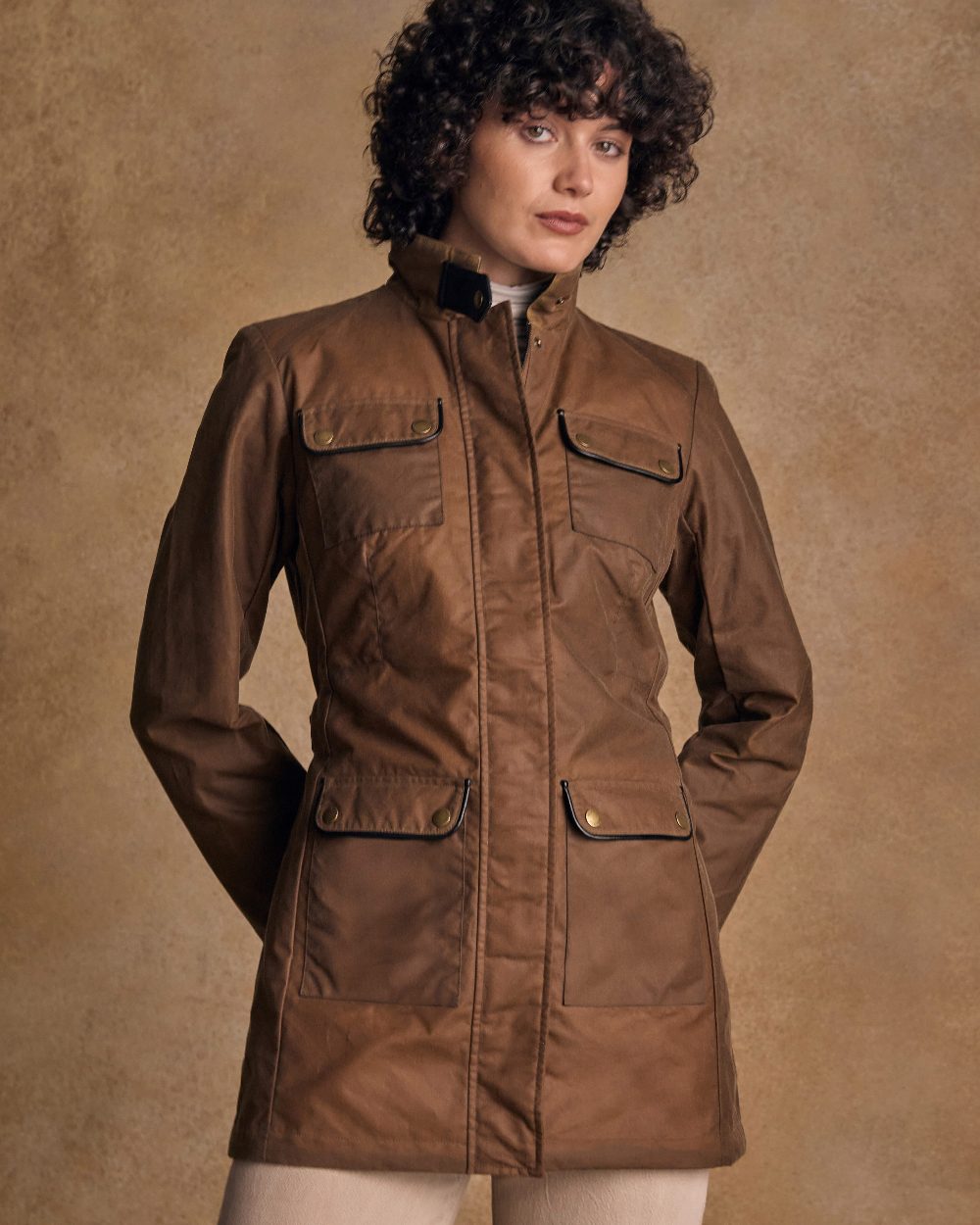 Tan Coloured Jack Murphy Womens Orla Wax Jacket on indoor background 