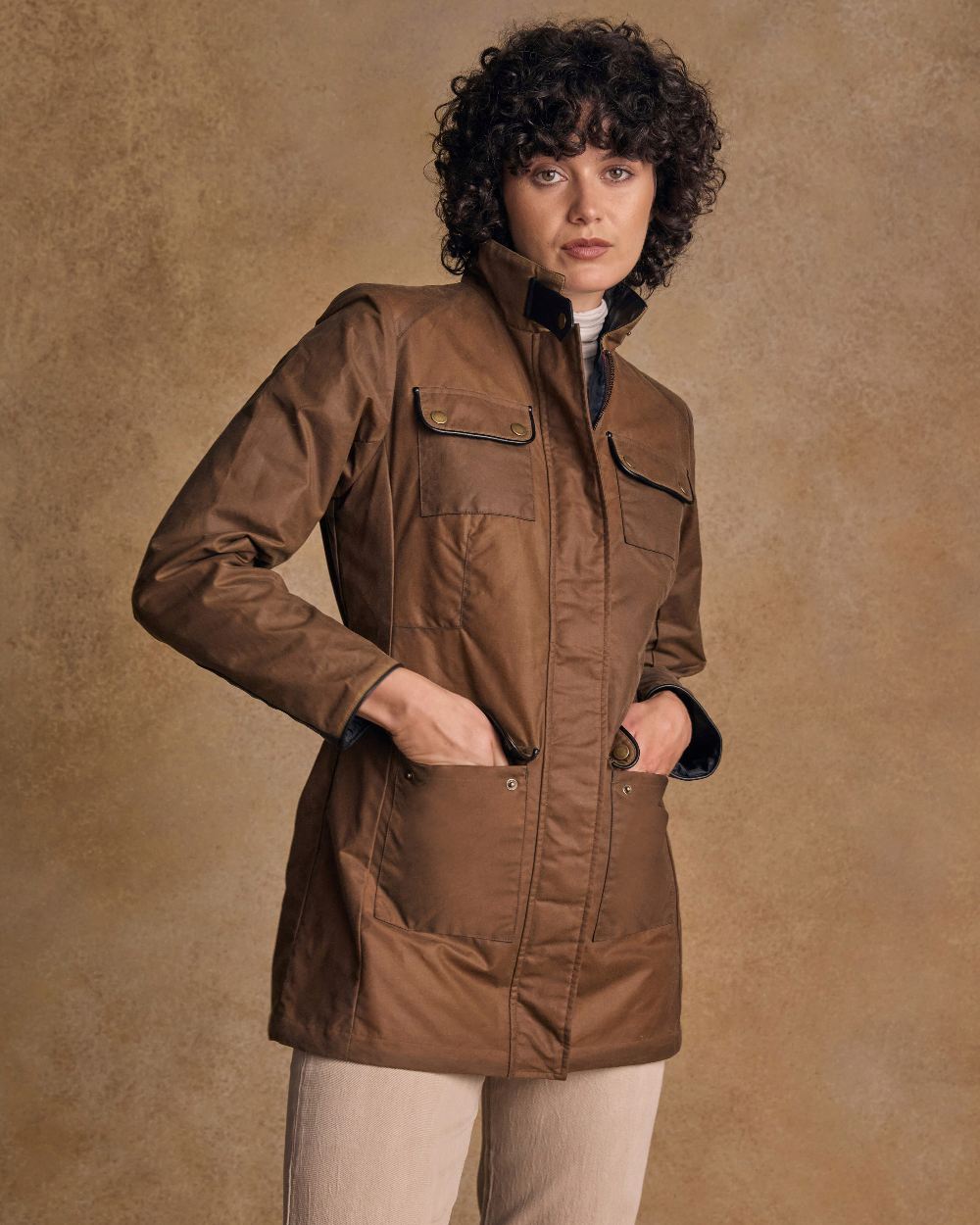 Tan Coloured Jack Murphy Womens Orla Wax Jacket on indoor background 