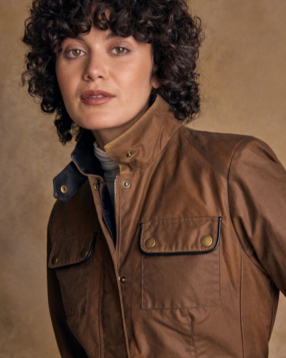 Tan Coloured Jack Murphy Womens Orla Wax Jacket on indoor background 