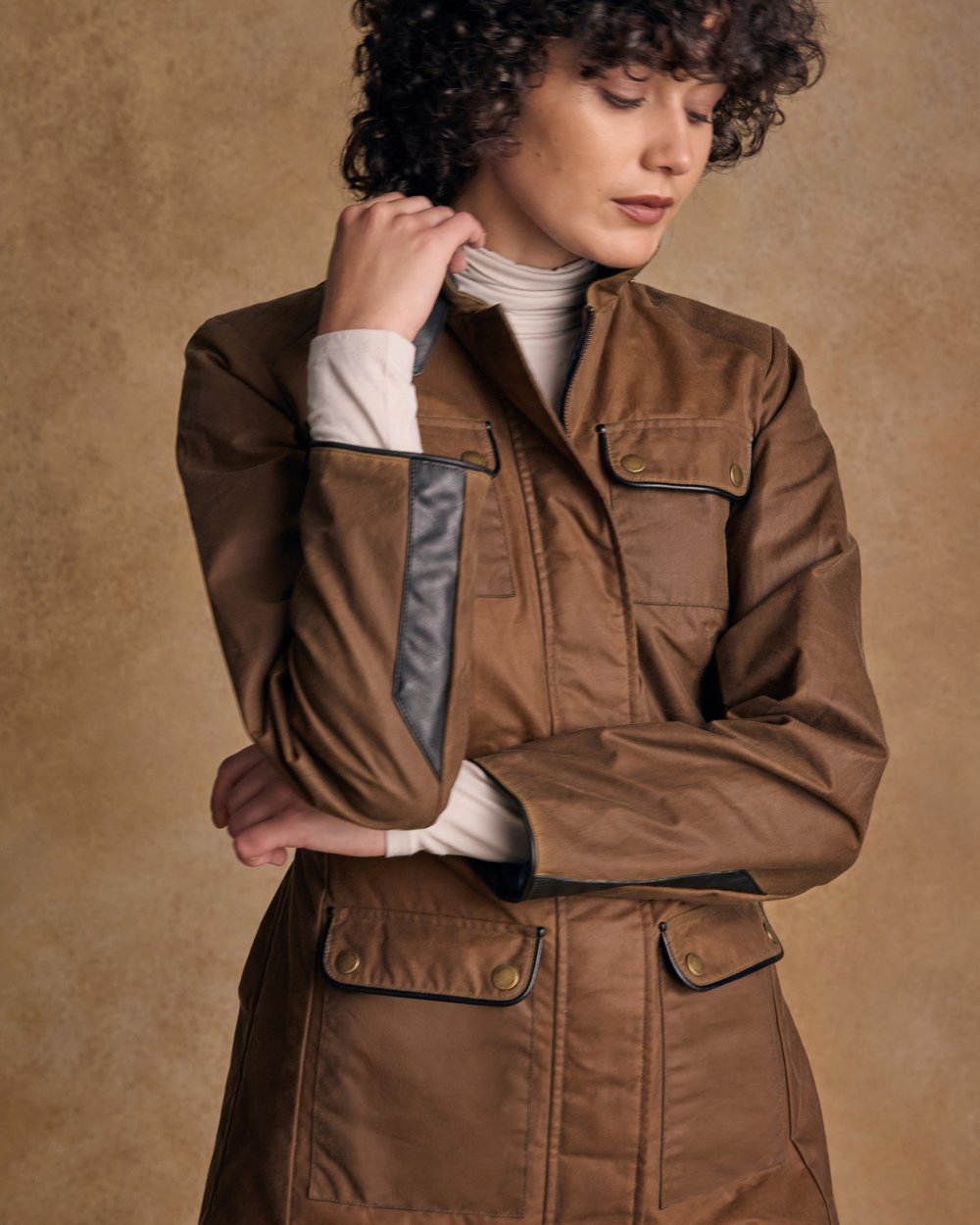 Tan Coloured Jack Murphy Womens Orla Wax Jacket on indoor background 