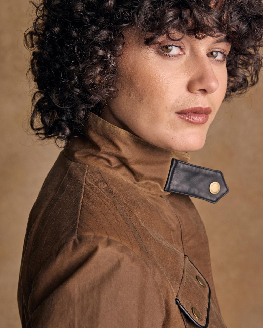 Tan Coloured Jack Murphy Womens Orla Wax Jacket on indoor background 