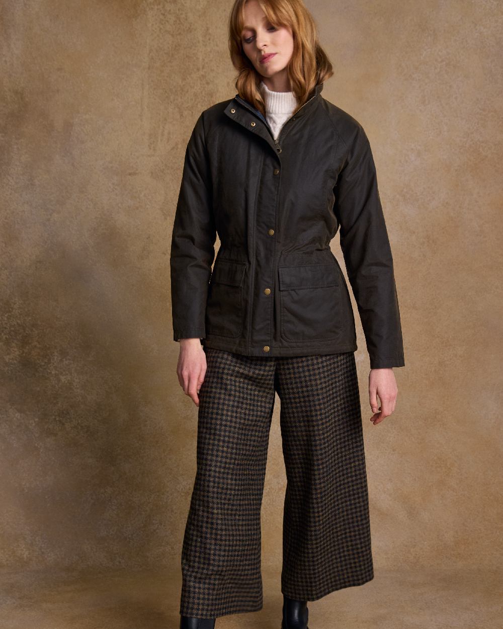 Olive Coloured Jack Murphy Womens Sally Wax Jacket on indoor background 