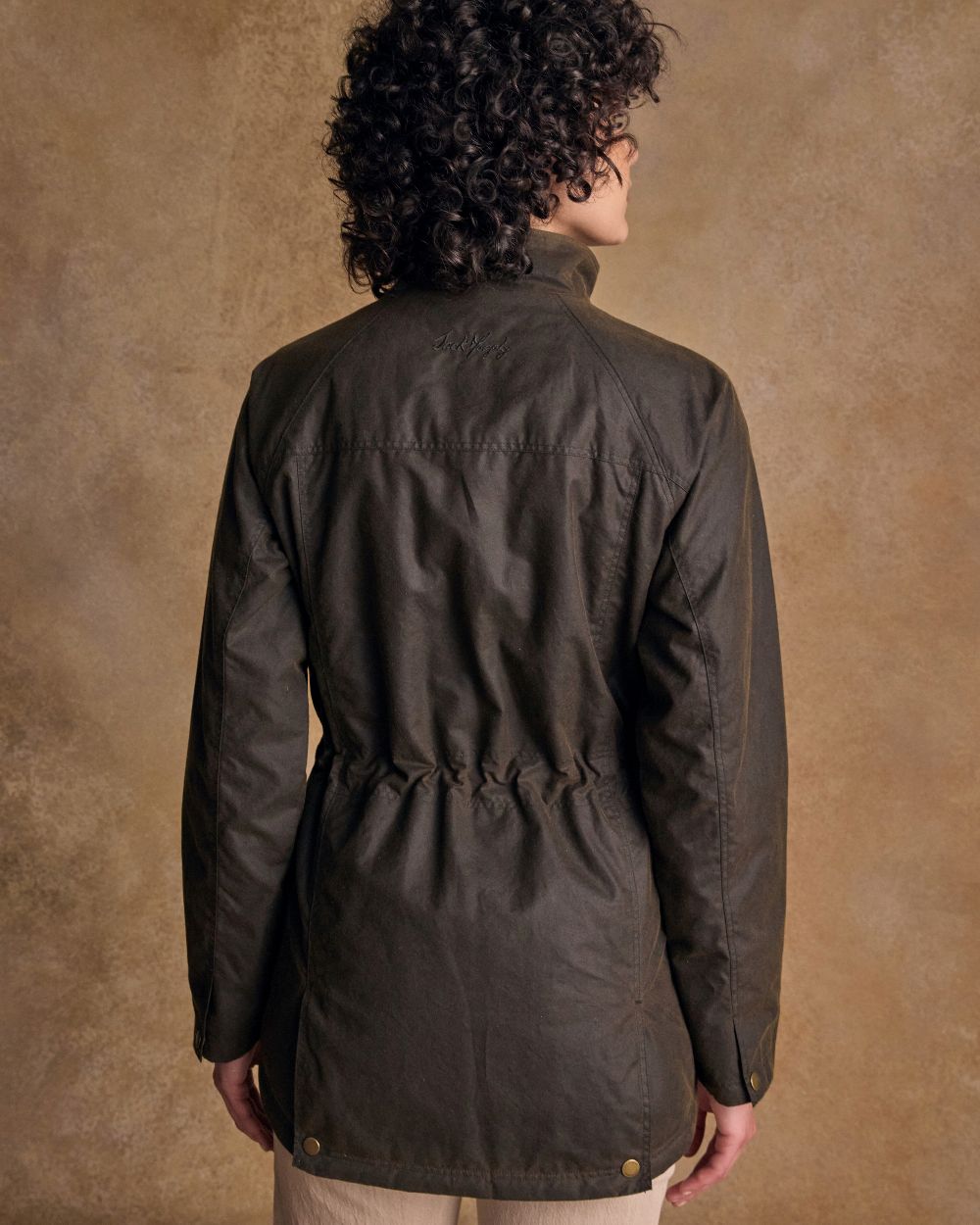 Olive Coloured Jack Murphy Womens Sally Wax Jacket on indoor background 