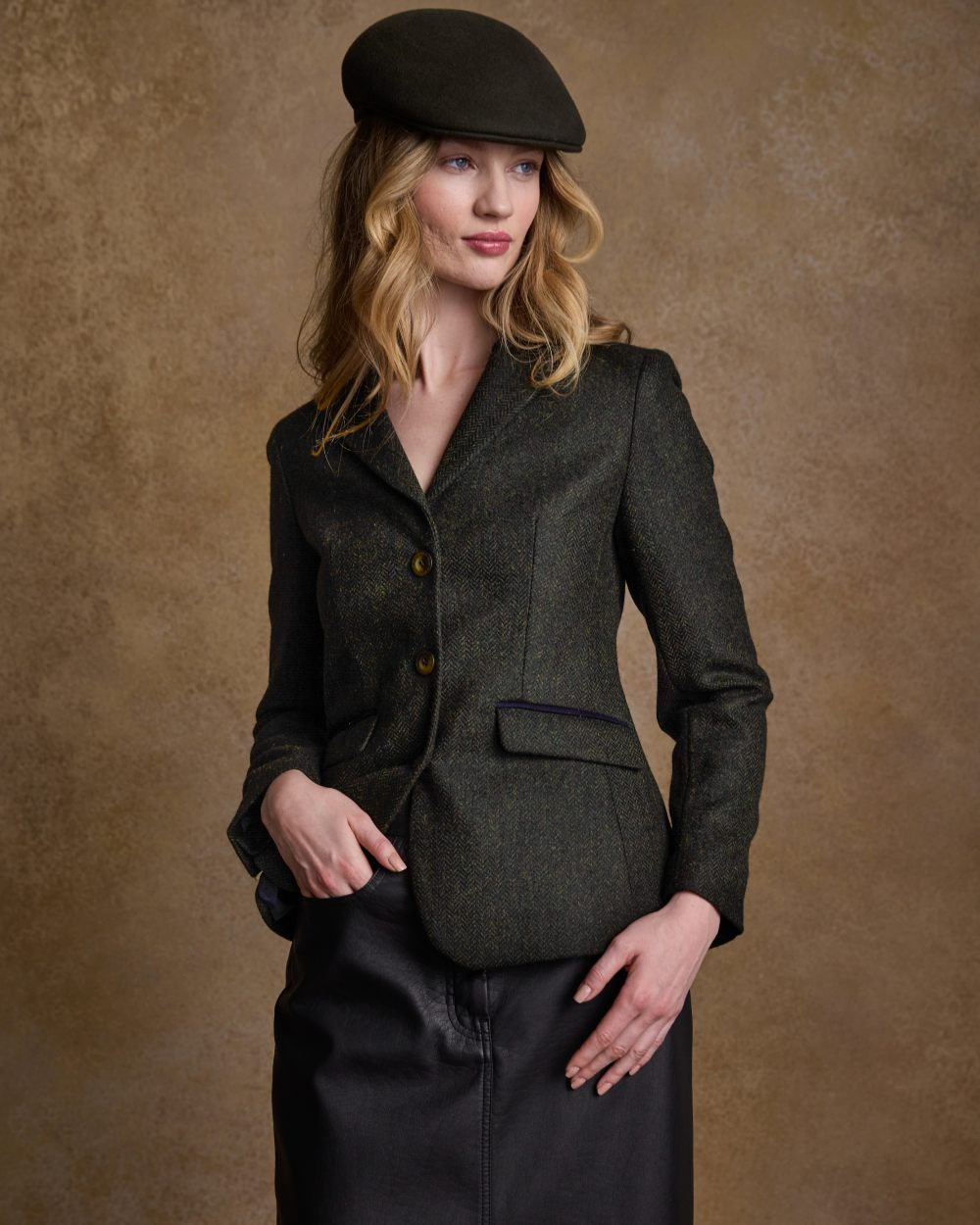 Deep Green Herringbone coloured Jack Murphy Womens Tara Tweed Hacking Jacket on textured 