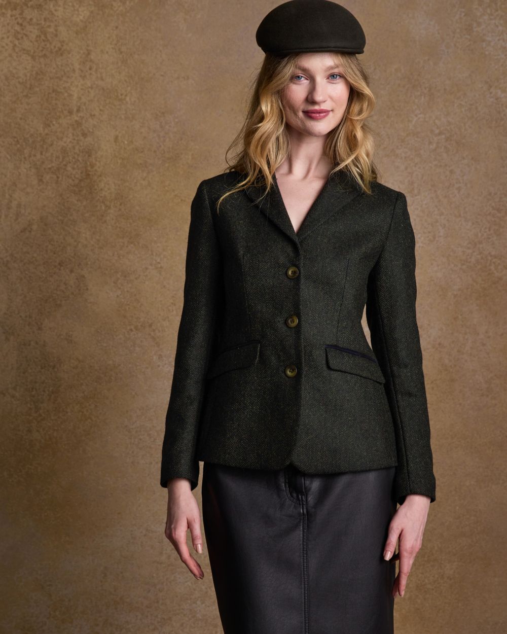 Deep Green Herringbone coloured Jack Murphy Womens Tara Tweed Hacking Jacket on textured 