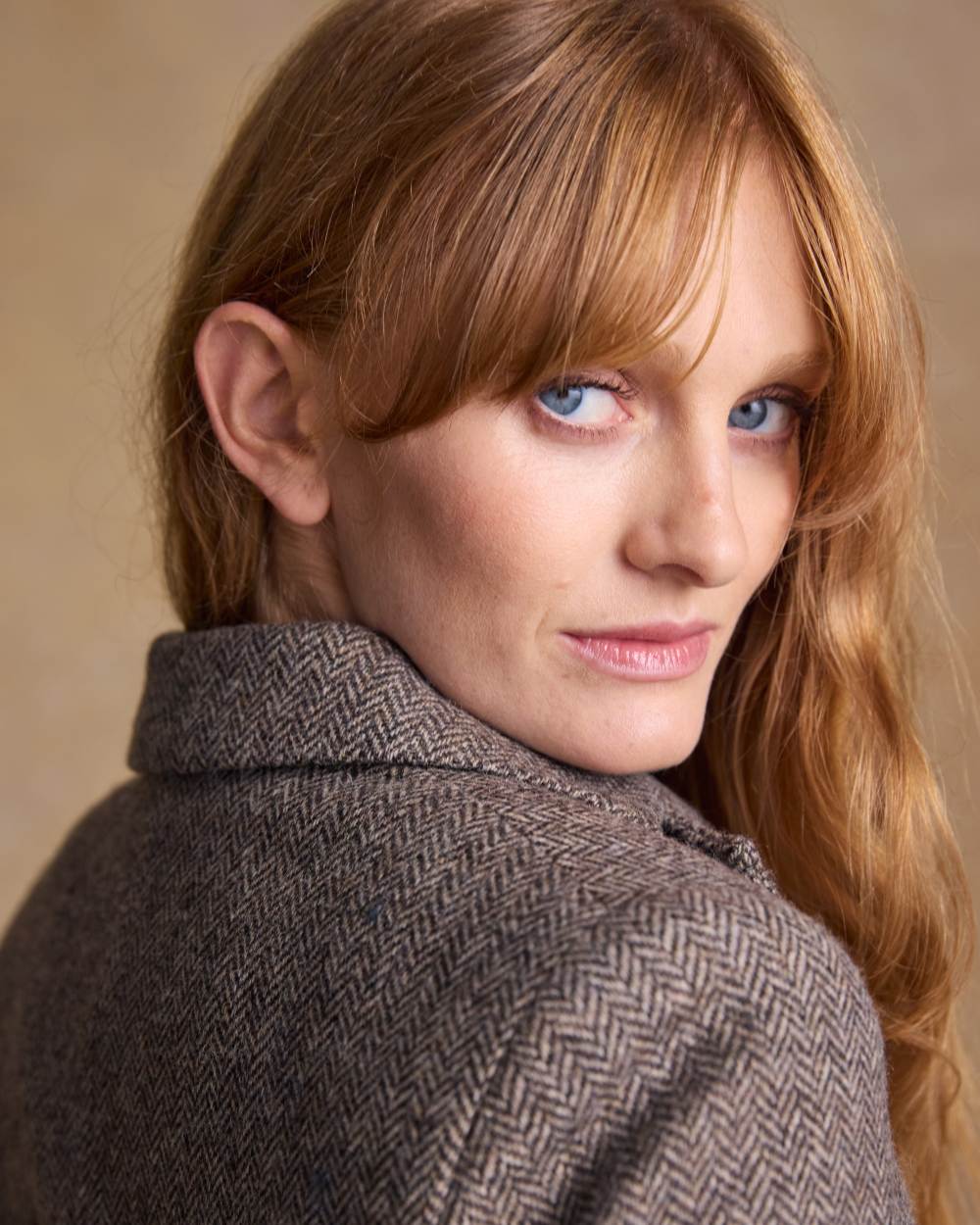 Light Tan Herringbone coloured Jack Murphy Womens Tara Tweed Hacking Jacket on textured 