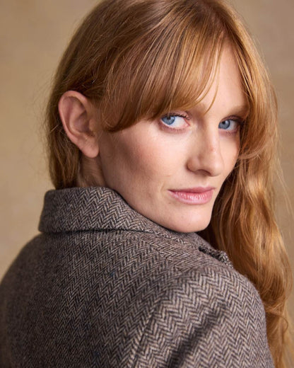 Light Tan Herringbone coloured Jack Murphy Womens Tara Tweed Hacking Jacket on textured 