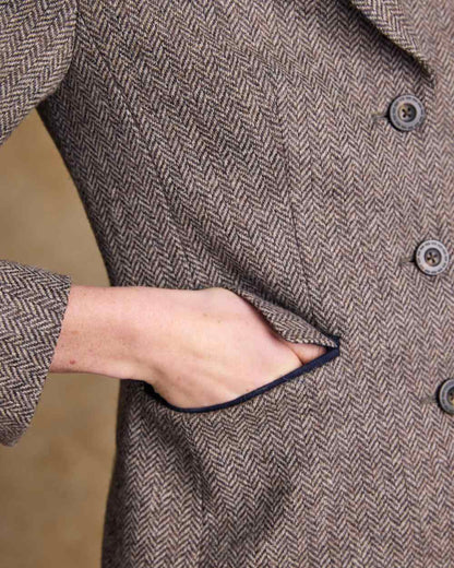 Light Tan Herringbone coloured Jack Murphy Womens Tara Tweed Hacking Jacket on textured 