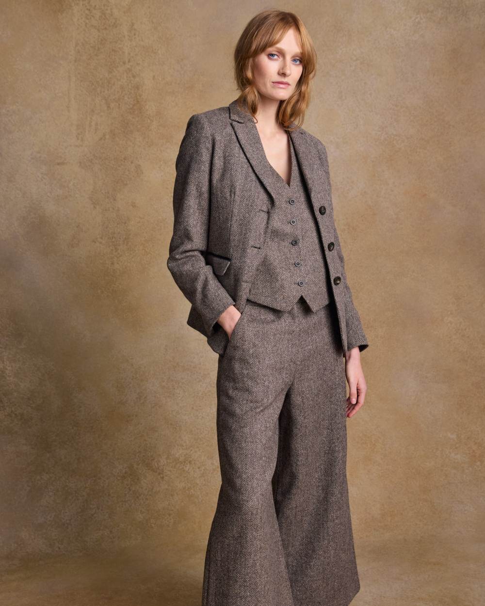 Light Tan Herringbone coloured Jack Murphy Womens Tara Tweed Hacking Jacket on textured 