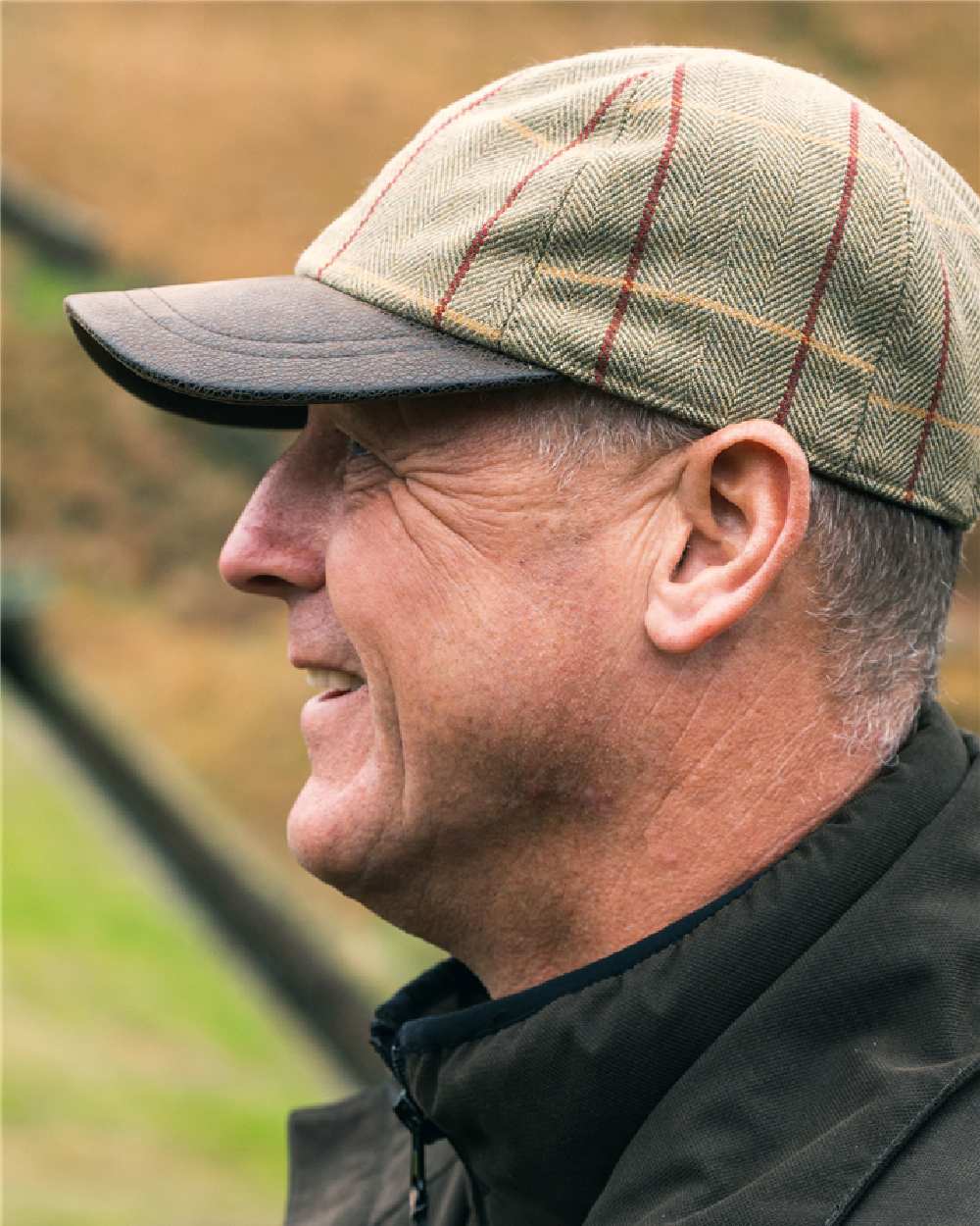 Tweed coloured Jack Pyke Baseball Hat on blurry background 